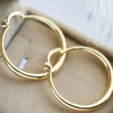 Large hoop earrings in gold
